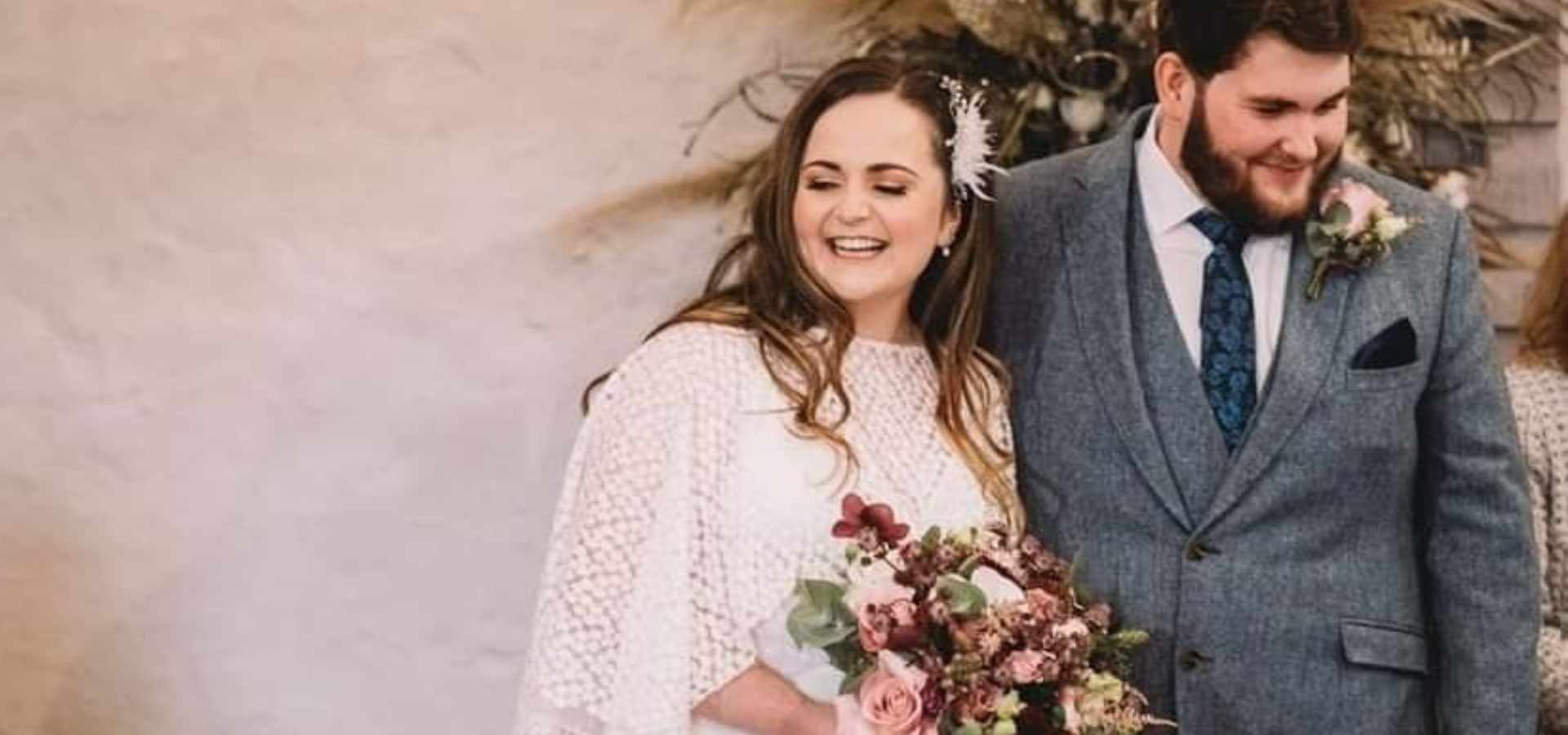 Image of beautiful smiling bride and husband. Brides hair dressed by Bethany Eleanor Mobile Hair & Beauty